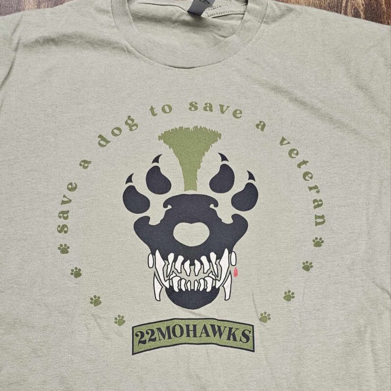 A t-shirt with a dog paw and the words " save a dog to save a veteran ".