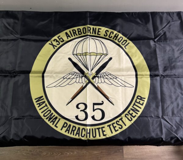 X35 Airborne School flag with parachute design.