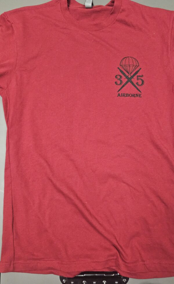 Red t-shirt with "Airborne" graphic design.